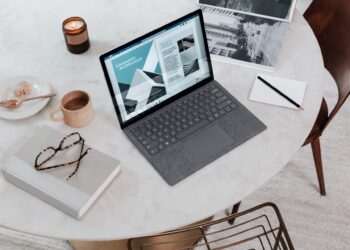 Laptop over the white table