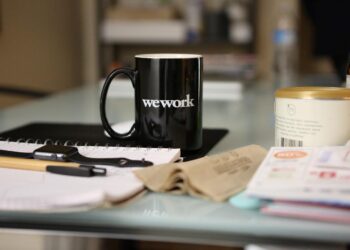 Black cup of coffee on table