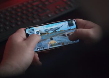 Man playing PUBG Mobile with iPhone