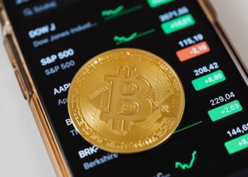Golden Bitcoin over mobile app