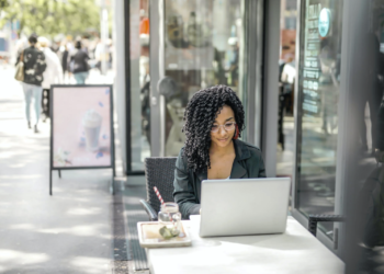 Woman using her laptop on coffee shop