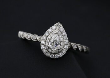 Pear-shaped diamond engagement ring with a double halo.