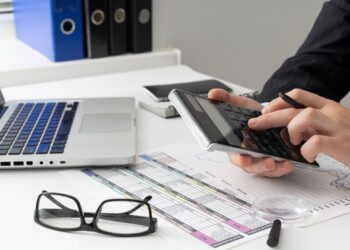 Man calculating his credit score