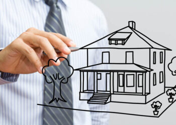 man drawing a house
