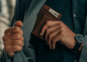 Man is grabbing wallet inside suite
