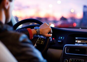 Hand on steering wheel