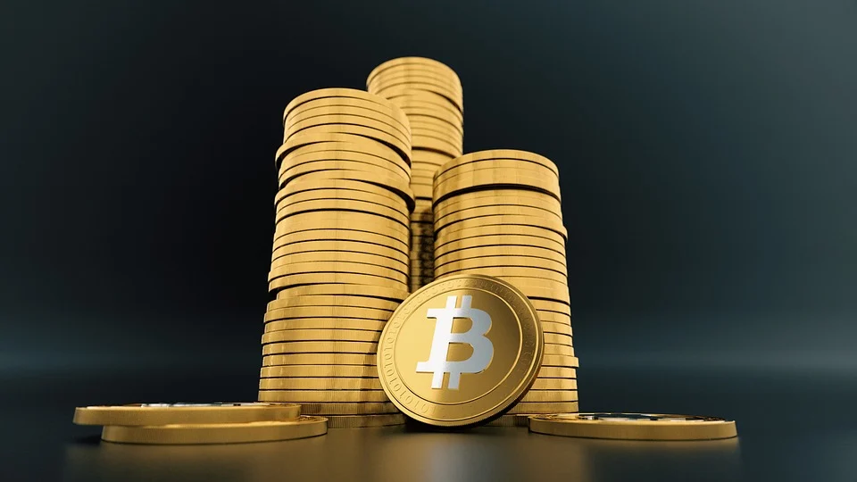 Tower of Golden Bitcoins | FintechZoom
