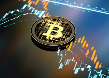 Bitcoin coin over a candlestick chart | FintechZoom