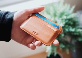 Credit Cards in brown wallet - FintechZoom