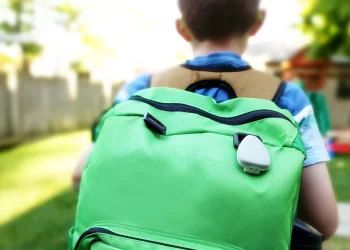 Tracker Tag on a Green schoolbag | FintechZoom