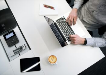 Person using Laptop | FintechZoom