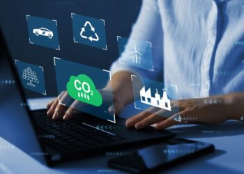 Person on computer with digital images near his hands | FintechZoom