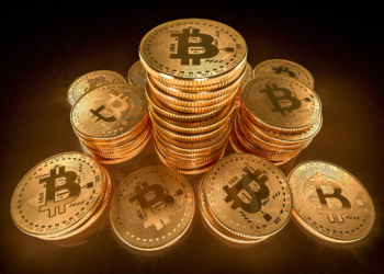 Several Golden Bitcoins | FintechZoom