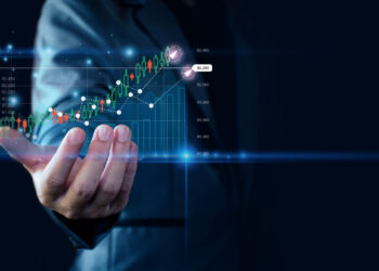 Businessman showing a graph of rising stocks | FintechZoom