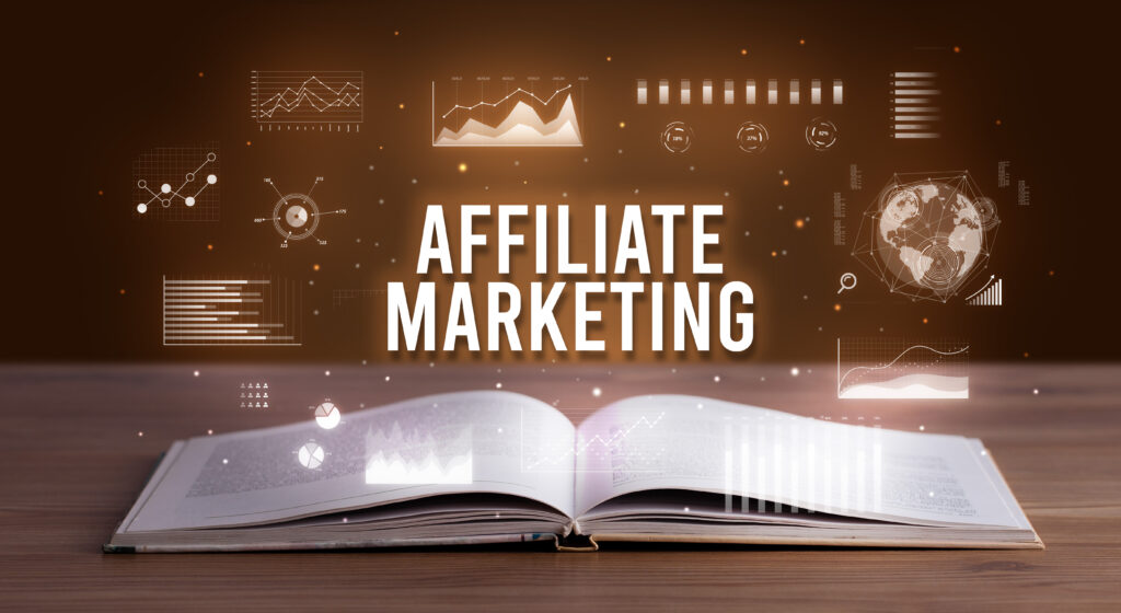 AFFILIATE MARKETING inscription coming out from an open book, creative business concept | FintechZoom