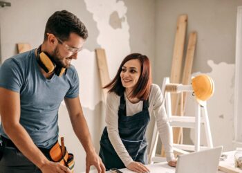 Mean and Woman looking for a plan of improvements in their home | FintechZoom