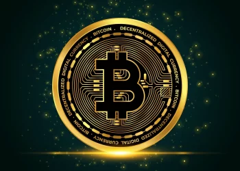 Golden bitcoin over black drop | FintechZoom