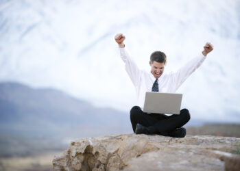Happy man Happy wit a laptop | FintechZoom