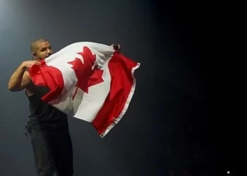 Person with Canada Flag | FintechZoom