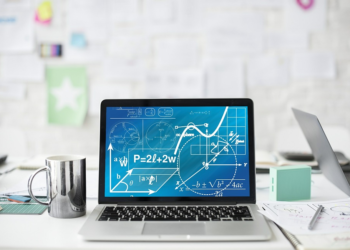 Laptop with math formulas on desktop | FintechZoom