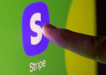 Stripe app logo is displayed in mobile phone | FintechZoom