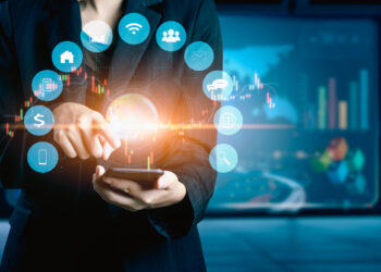 Businesswomen using mobile phone Financial Instruments | FintechZoom