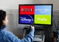Person watching streaming | FintechZoom