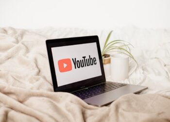 YouTube on Laptop over Bed | FintechZoom