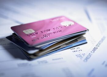 Credit Cards on table | FintechZoom