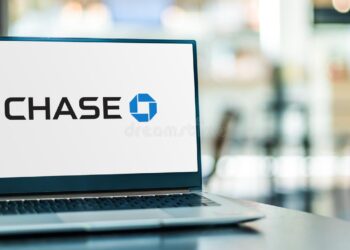 Laptop computer displaying logo chase bank | FintechZoom