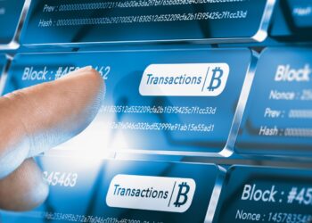 Person touching in digital panel with blockchain transactions | FintechZoom