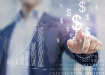 Businessman presenting financial analysis with charts generated by big data displaying international success and dollar signs | FintechZoom