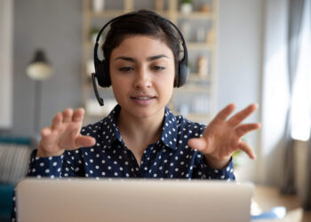 Woman going through virtual training | FintechZoom