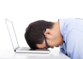 Person bored on laptop | FintechZoom