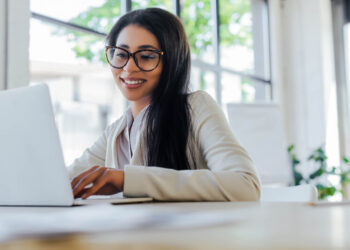 Eyewear - woman on laptop | FintechZoom