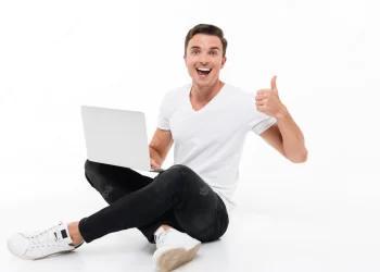 Person happy on laptop | FintechZoom