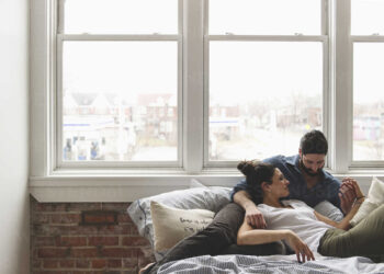 Couple resting in fresh home | FintechZoom