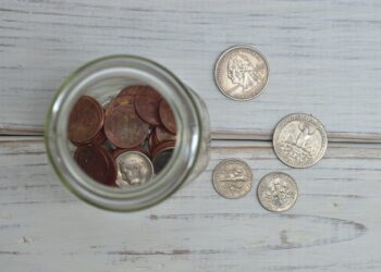Coins Inside Jar | FintechZoom