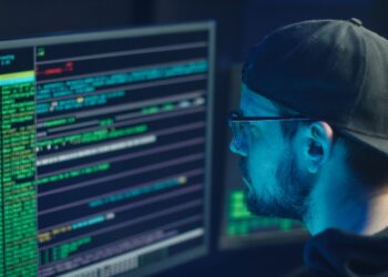 Man in Blue Crew Neck Shirt Wearing Black Framed Eyeglasses | FintechZoom