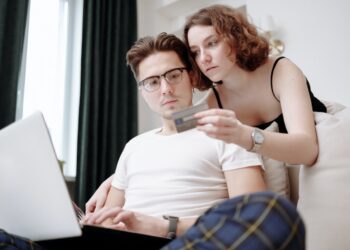 Man Typing Credit Card Details | FintechZoom