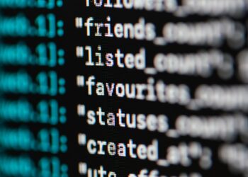 Extreme Close-up Photo of Codes on Screen | FintechZoom