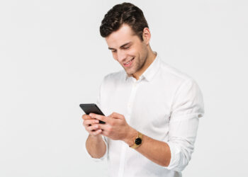 Man on Mobile | FintechZoom