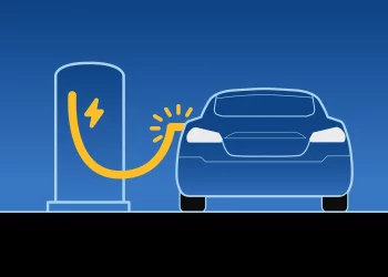 Illustration of an electric car being charged at a charging station. The car is depicted in blue with a yellow charging cable connected to the station, which has a lightning bolt symbol indicating electricity. Set against a gradient blue background, this image subtly resonates with the comparative analysis of EV stocks. | FintechZoom
