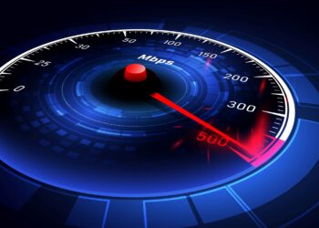 An illustration of a futuristic speedometer displaying internet speed in Mbps (megabits per second). The needle points to 500 Mbps on a vibrant, glowing, blue and red circular gauge with digital effects and a dark background, resembling a high-tech Wifi Speed Test. | FintechZoom