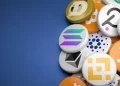A variety of cryptocurrency tokens are displayed on a blue background. Visible tokens feature logos of popular cryptocurrencies, including Bitcoin, Ethereum, Binance, Solana, and others—symbolizing diverse digital assets and highlighting Crypto Prices Today in the crypto market. | FintechZoom