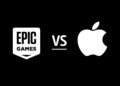 A black background shows the white Epic Games logo on the left and the white Apple logo on the right with a "VS" in the center, signifying a face-off that has even impacted Apple stock. | FintechZoom