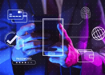 A person in a suit uses a smartphone. Various digital security icons surround the phone, including a credit card, fingerprint, shield, check mark, globe, wallet, and a password field. The dark background with blue and pink lighting highlights the importance of cyber security and its lucrative salary prospects. | FintechZoom