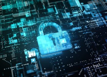 A glowing digital lock icon is overlaid on a blue and black circuit board background, symbolizing cybersecurity and data protection. The intricate design of the circuitry highlights the complex nature of protecting digital information, embodying the advanced solutions from Trendzguruji.me Cyber. | FintechZoom