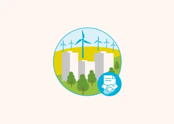 Illustration of a sustainable city with wind turbines in the background, buildings, and trees in the foreground. A blue icon overlay shows a handshake and document, symbolizing collaboration or agreements like Power Purchase Agreements related to environmental initiatives. | FintechZoom
