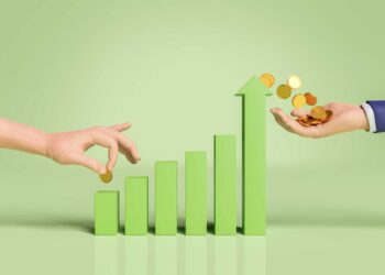 Two hands are interacting with a green bar graph. The left hand is placing a coin on the lowest bar, while the right hand, positioned above the highest bar, holds a pile of coins with some falling down, symbolizing Best CD Rates growth. The background is solid light green. | FintechZoom